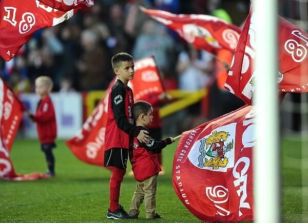 Young Flag Bearer Assisted at Bristol City vs Swindon Town Football Match, April 2015