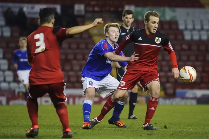 Framed Print : Young Stars Clash: Intense Football Action - FA Youth Cup Third Round Proper: Bristol City U18 vs Ipswich Town U18, December 2012
