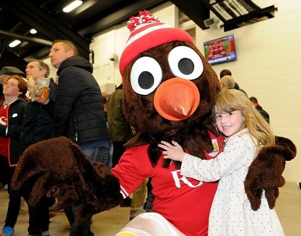 Young Supporter Shares Excitement with Scrumpy at Bristol City vs. Nottingham Forest Match, Ashton Gate Stadium, 2015
