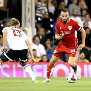 Print of Aaron Wilbraham Dashing Past Tim Ream Print of Aaron Wilbraham Dashing Past Tim Ream