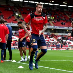 Print of Aden Flint warming up at Oakwell Stadium Print of Aden Flint warming up at Oakwell Stadium
