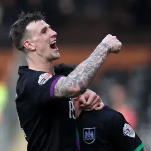 Aden Flint and Lee Tomlin Celebrate Winning Goal: Fulham vs. Bristol City, 2016