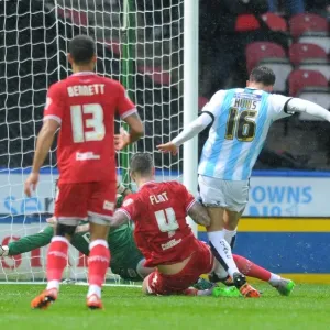 Aden Flint Tackles Emyr Huws in Intense Championship Clash: Huddersfield Town vs. Bristol City Aden Flint Tackles Emyr Huws in Intense Championship Clash: Huddersfield Town vs. Bristol City