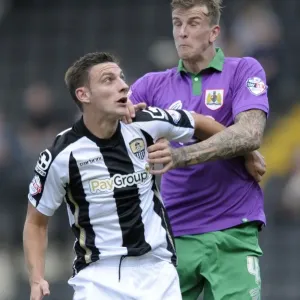 Aden Flint vs Jake Cassidy: Intense Header Battle in Notts County vs Bristol City Football Match, August 2014 Aden Flint vs Jake Cassidy: Intense Header Battle in Notts County vs Bristol City Football Match, August 2014