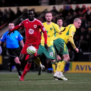 Print of Albert Adomah outmaneuvering Marc Tierney in a Championship match