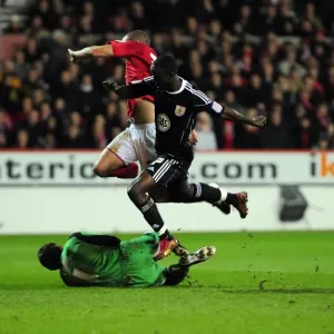 Adomah vs. Camp: Intense Battle for the Ball in Nottingham Forest vs. Bristol City Championship Clash