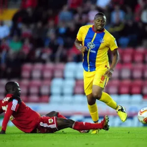 Adomah vs. Dikgacoi: Intense Battle in the Championship Clash between Bristol City and Crystal Palace, 2012