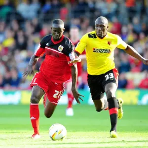 Print of Albert Adomah vs. Nyron Nosworthy in action
