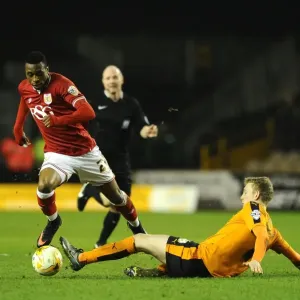 Avoiding a Tackle: Kodjia Eves Dangerously Past Saville in Wolves vs. Bristol City Clash