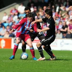 Battle for the Ball: Hartley, Nyatanga, and Sparrow Clash in Scunthorpe vs. Bristol City Championship Match, 17/04/2010 Battle for the Ball: Hartley, Nyatanga, and Sparrow Clash in Scunthorpe vs. Bristol City Championship Match, 17/04/2010