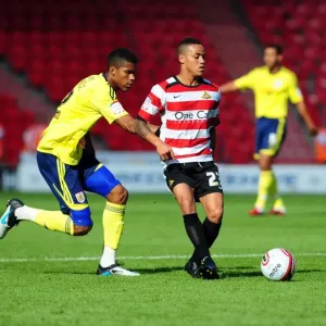 Print of Jordan Spence battling Kyle Bennett for the ball