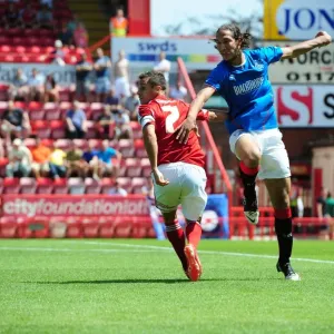 Battleground Bristol: Baldock vs Cribari - A Striker Showdown at Ashton Gate