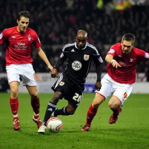 Battling for the Ball: Jamal Campbell-Ryce Faces Off Against Luke Chambers and Chris Cohen in Intense Npower Championship Match