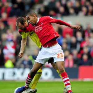 Battling for the Ball: Louis Carey vs. Dexter Blackstock - Nottingham Forest vs. Bristol City Football Rivalry, 07/04/2012 Battling for the Ball: Louis Carey vs. Dexter Blackstock - Nottingham Forest vs. Bristol City Football Rivalry, 07/04/2012