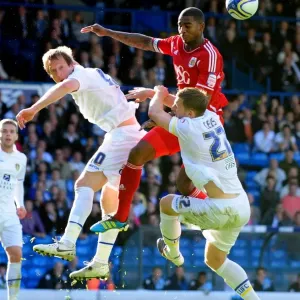 Battling for the Ball: Marvin Elliott vs. Becchio and Somma in the Intense 2011 League Cup Clash between Leeds United and Bristol City Battling for the Ball: Marvin Elliott vs. Becchio and Somma in the Intense 2011 League Cup Clash between Leeds United and Bristol City