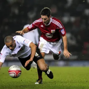Battling for Championship Supremacy: Johnson vs. Pratley (2011) - A Football Rivalry at Ashton Gate