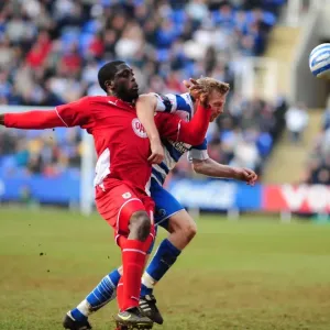 Battling for Control: Akinde vs. Gunnarsson in the Intense Championship Showdown between Reading and Bristol City (13/03/2010) Battling for Control: Akinde vs. Gunnarsson in the Intense Championship Showdown between Reading and Bristol City (13/03/2010)