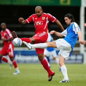 Battling for Control: Elliott vs. Boyd in Peterborough United vs. Bristol City Football Match