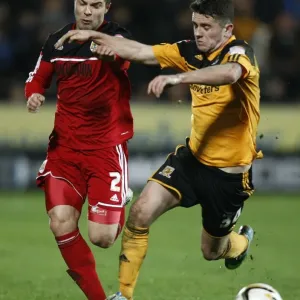 Print of a footballer in action, featuring Richard Foster and Robbie Brady