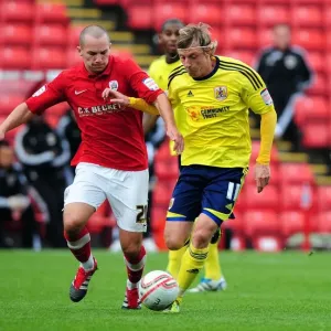 Battling Midfielders: Woolford vs Drinkwater in Barnsley vs Bristol City Championship Clash, 2011