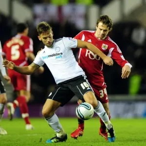 Battling for Supremacy: Brett Pitman vs. James Bailey in Derby County vs. Bristol City Championship Clash - 10/12/2011