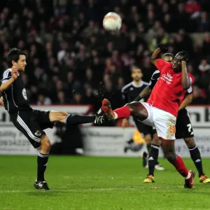 Battling for Supremacy: Cole Skuse vs. Guy Moussi in Nottingham Forest vs. Bristol City Football Match, 2011