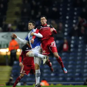 Battling for Supremacy: Cunningham vs. Rochina in FA Cup Clash at Ewood Park