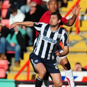 Battling for Supremacy: Iwelumo vs. Tamas in the Championship Clash between Bristol City and West Bromwich Albion (February 2010)