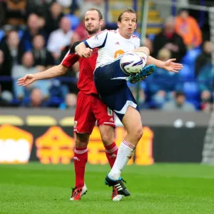 Battling for Supremacy: Kevin Davies vs. Louis Carey in the 2010-11 Championship Clash between Bolton Wanderers and Bristol City Battling for Supremacy: Kevin Davies vs. Louis Carey in the 2010-11 Championship Clash between Bolton Wanderers and Bristol City