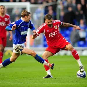 Battling for Supremacy: Liam Fontaine vs. Lee Martin in Ipswich Town vs. Bristol City Football Match, March 2012