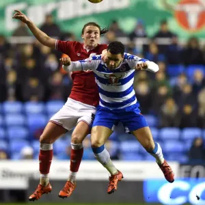 Battling for Supremacy: Luke Ayling vs. Hal Robson-Kanu in the Sky Bet Championship Clash between Reading and Bristol City