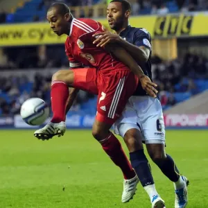 Battling for Supremacy: Marvin Elliott vs. Liam Trotter in the Championship Clash between Millwall and Bristol City Battling for Supremacy: Marvin Elliott vs. Liam Trotter in the Championship Clash between Millwall and Bristol City