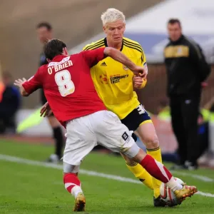 Battling for Supremacy: McGivern vs. O'Brien in Championship Clash between Barnsley and Bristol City
