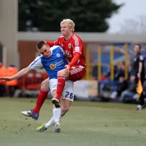 Battling for Supremacy: McGivern vs. Taylor in Peterborough United vs. Bristol City Football Match, 2012