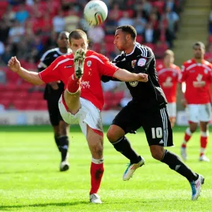 Battling for Supremacy: Nicky Maynard vs. Stephen Foster in the Championship Clash between Barnsley and Bristol City (09/04/2011) Battling for Supremacy: Nicky Maynard vs. Stephen Foster in the Championship Clash between Barnsley and Bristol City (09/04/2011)