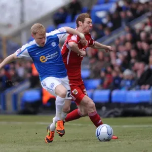 Battling for Supremacy: Pearson vs. Taylor - A Football Rivalry Unfolds at London Road Stadium