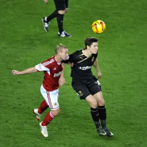 Battling for Supremacy: Simon Gillett vs. Josh Simpson in Cardiff City vs. Swansea City Football Match Battling for Supremacy: Simon Gillett vs. Josh Simpson in Cardiff City vs. Swansea City Football Match