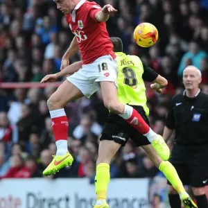 Battling for Supremacy: Wilbraham vs Jones in Bristol City vs Oldham Athletic Football Clash
