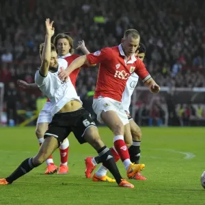 Battling for Supremacy: Wilbraham vs Turnbull in the Heated Rivalry of Bristol City vs Swindon Town (April 2015)