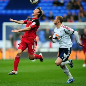Battling for Supremacy: Woolford vs. Mills in the 2010-11 Championship Clash between Bolton Wanderers and Bristol City Battling for Supremacy: Woolford vs. Mills in the 2010-11 Championship Clash between Bolton Wanderers and Bristol City