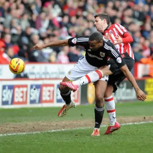 Bob Howard vs Tyrone Barnett: Intense Battle for the Ball in Sheffield United vs Bristol City Football Match, 2014 Bob Howard vs Tyrone Barnett: Intense Battle for the Ball in Sheffield United vs Bristol City Football Match, 2014