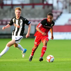 Bobby Reid in Action: A Thrilling Pre-Season Football Moment at Dunfermline's East End Park Bobby Reid in Action: A Thrilling Pre-Season Football Moment at Dunfermline's East End Park