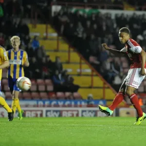 Bobby Reid Goes for Glory: A Pivotal Moment in the Bristol City vs. Brentford Football Match, October 2013