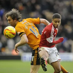 Bobby Reid vs. Kevin McDonald: Aerial Battle in Wolves vs. Bristol City Football Match, 2014