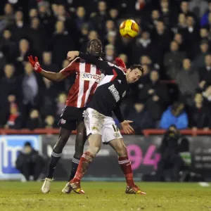 Brentford vs. Bristol City: Intense Battle for the Ball between Clayton Donaldson and Greg Cunningham Brentford vs. Bristol City: Intense Battle for the Ball between Clayton Donaldson and Greg Cunningham