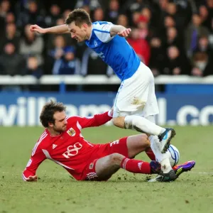 Brett Pitman of Bristol City Tackles Lee Frecklington of Peterborough United during the Football Match