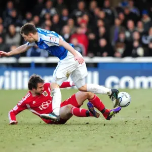 Brett Pitman Tackles Lee Frecklington: Intense Moment in Peterborough United vs. Bristol City Football Match, 2012