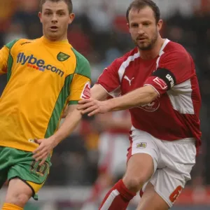 Bristol City: Carey and Cureton Clash in Action Against Norwich City Bristol City: Carey and Cureton Clash in Action Against Norwich City