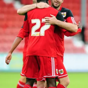 Bristol City Celebrates Double Strike: Albert Adomah and Brett Pitman Rejoice after Goals vs. Dunfermline Athletic (August 1, 2012) Bristol City Celebrates Double Strike: Albert Adomah and Brett Pitman Rejoice after Goals vs. Dunfermline Athletic (August 1, 2012)