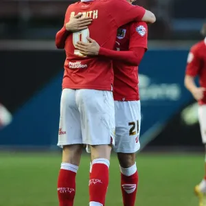 Bristol City Celebrates Win: Matt Smith and Marlon Pack Embrace after Goal vs. Fleetwood Town (01/02/2015)